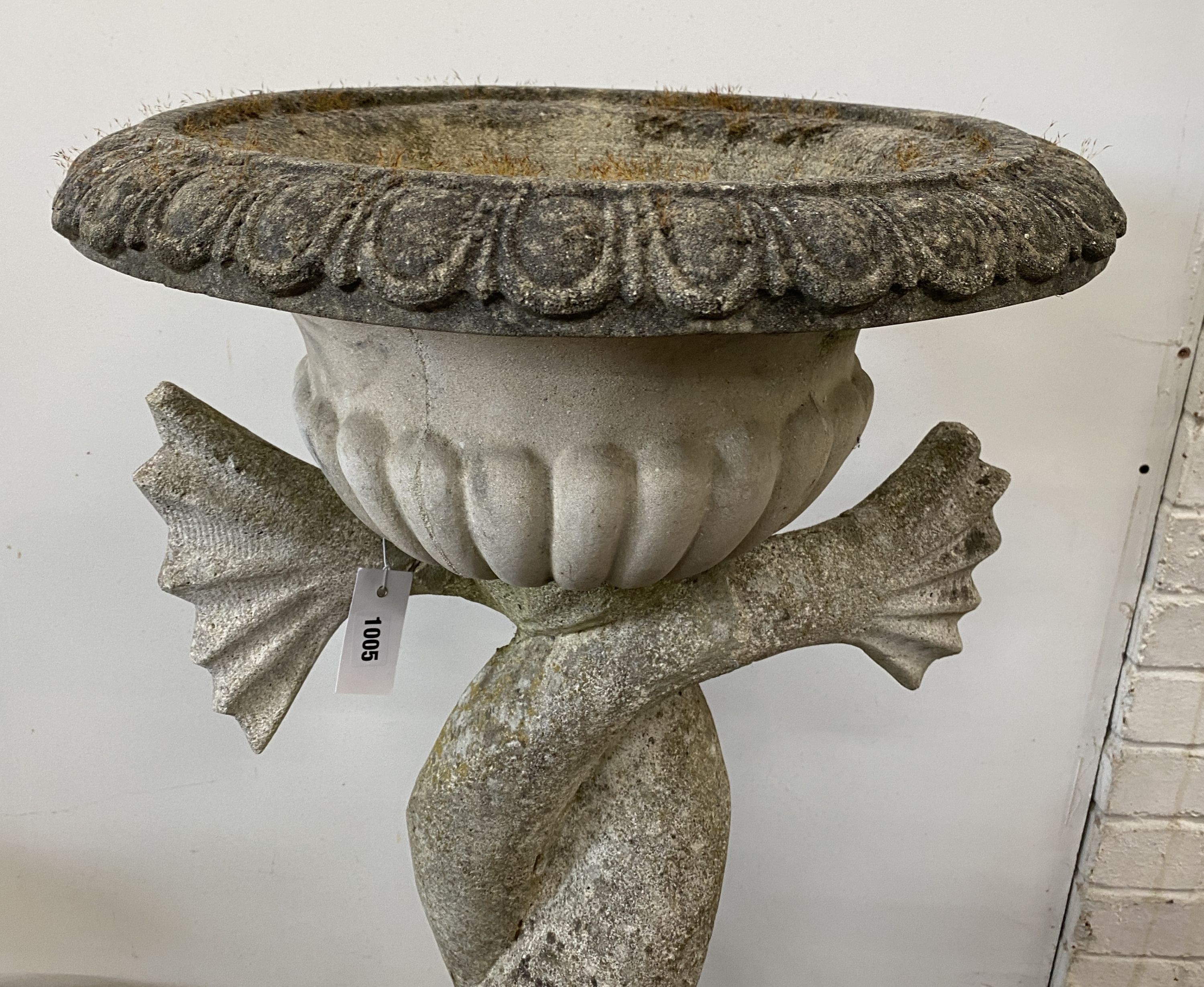 A large reconstituted stone dolphin garden planter, height 132cm